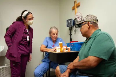 Nursing student May Emphasis, left, and RN Lorie LeJeune, sort through patient Eduardo Navarreteâs prescriptions at a medical clinic provided free of charge to local residents in Hope, Ark. on Sept. 7, 2023. Photo by Rory Doyle.